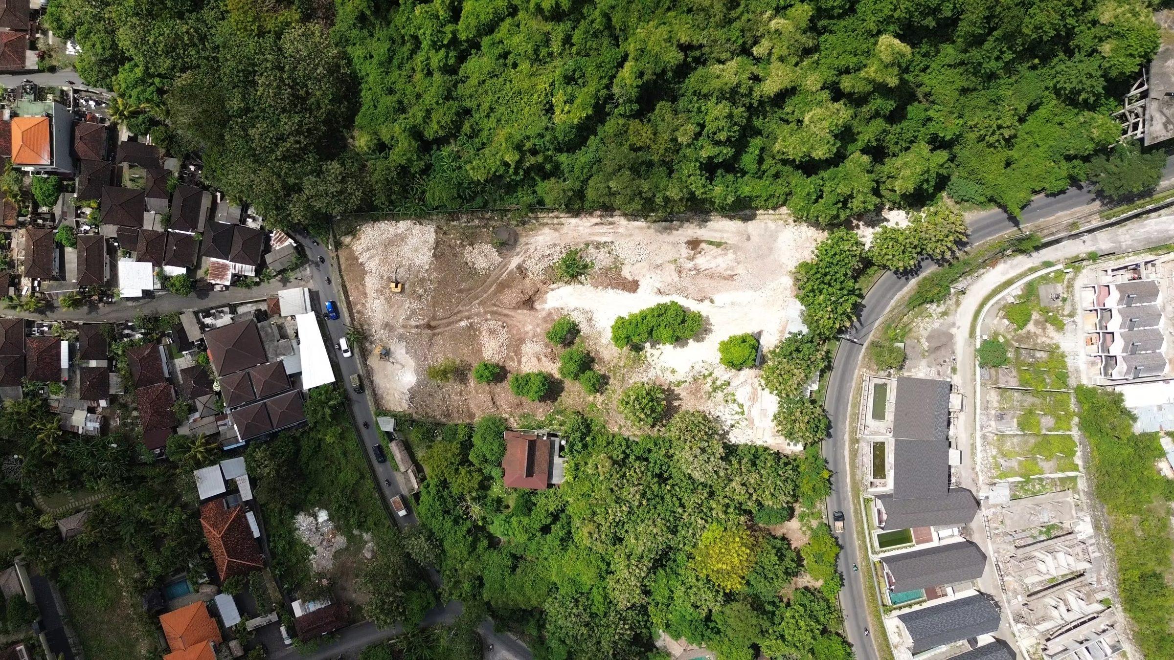 Villa construction in Bali with workers and concrete structure
