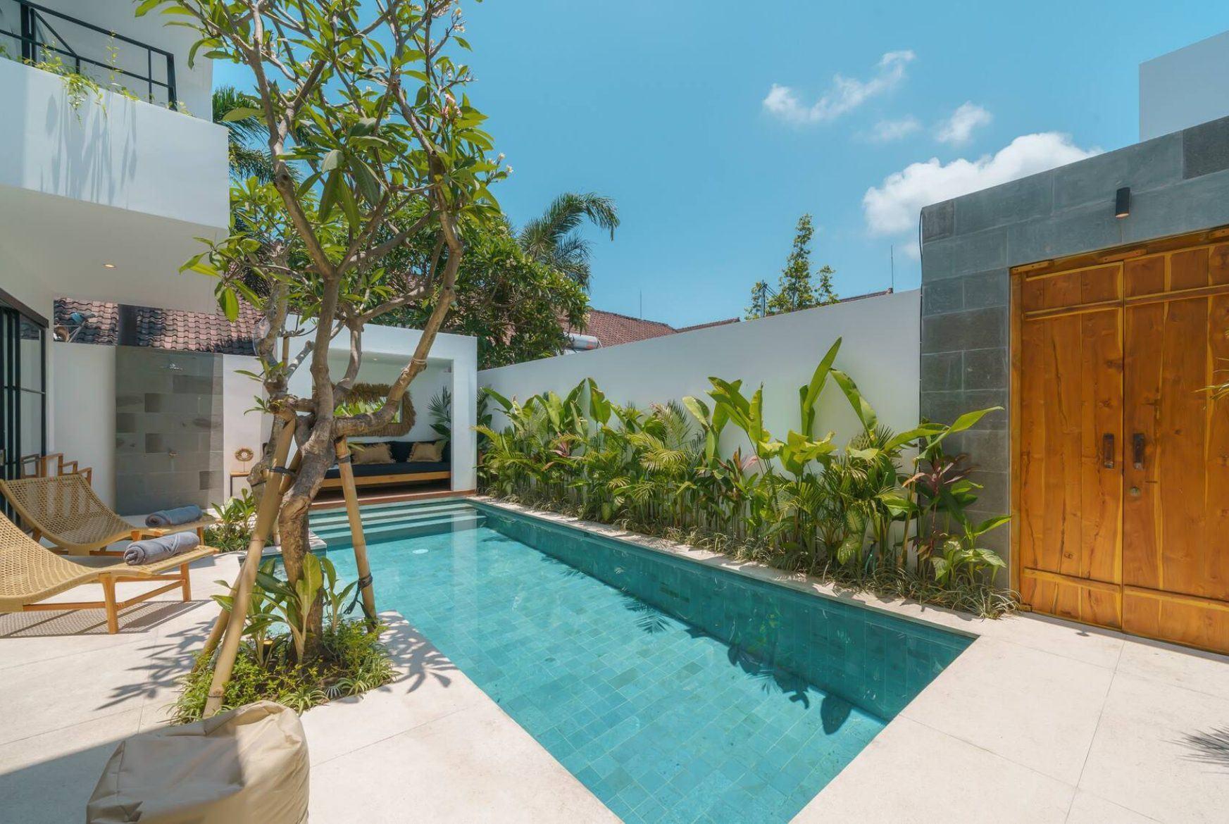 Villa patio with pool and frangipani tree, Ubud style